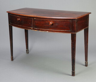A 19th Century mahogany bow front side table fitted 2 long drawers, raised on square tapered supports 76cm h x 111cm w x 55cm d 
