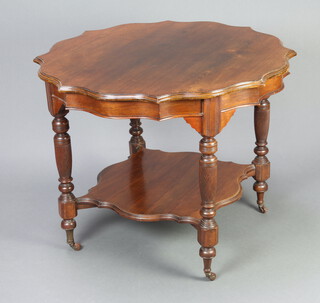 A Victorian shaped mahogany 2 tier occasional table raised on turned and reeded supports with undertier, 71cm h x 90cm w x 91cm d 