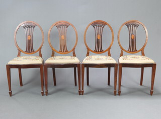 A set of 4 Edwardian Hepplewhite style inlaid mahogany slat back dining chairs with Berlin woolwork drop in seats, raised on square tapered supports 96cm h x 47cm w x 44cm d (seat 32cm x 29cm) 