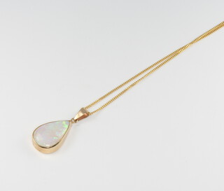 A 9ct yellow gold necklace with a pear shaped opal pendant, 4.5 grams gross, the pendant is 12mm the necklace is 44cm 