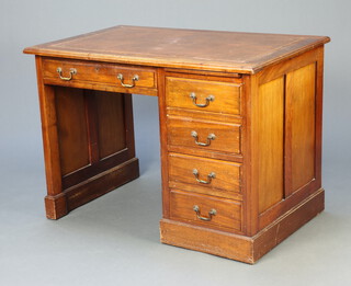 An Edwardian mahogany desk with inset leather writing surface, fitted 1 long drawer flanked by brushing slide and above 4 long drawers 76cm h x 107cm w x 69cm d 