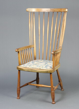 A 19th Century beech stick and rail back carver chair with upholstered seat, raised on turned supports with H framed stretcher 114cm h x 41cm w x 53cm d (seat 33cm x 36cm), the base marked 227 
