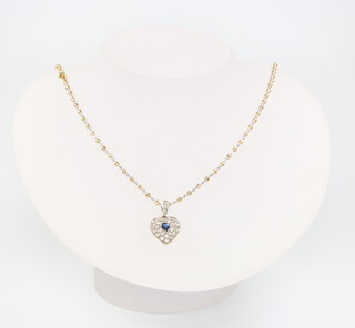 An 18ct yellow gold necklace 46cm together with a yellow metal heart shaped pendant, 12.3 grams gross