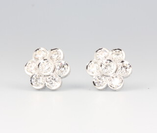 A pair of 18ct white gold seven stone diamond daisy ear studs 2.9ct, 13mm, 7.2 grams
