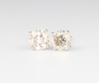 A pair of 18ct white gold single stone diamond ear studs approx. 2.14ct, 2.3 grams 
