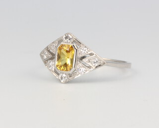 A platinum yellow sapphire and diamond ring, the sapphire 0.5ct, the diamonds 0.25ct, size N, 3.6 grams