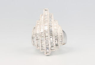 An 18ct white gold Art Deco style baguette cut diamond ring approx. 1.65ct, size O, 9.6 grams