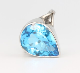 A 9ct yellow gold blue topaz pear cut ring, 16mm x 11mm, size M 1/2, 5.4 grams