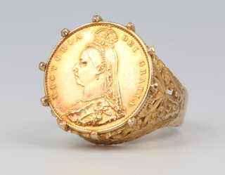 A yellow metal signet ring stamped 9ct containing a Victorian half sovereign, the yellow metal mount 4.9 grams, size S