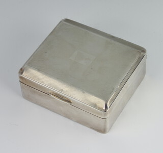 An Art Deco engraved silver cigarette box Birmingham 1937 9cm x 8cm 