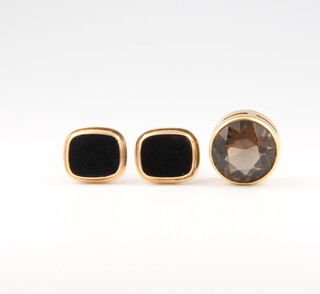 A pair of 14ct yellow gold onyx cufflinks, a ditto chain and a 9ct charm 