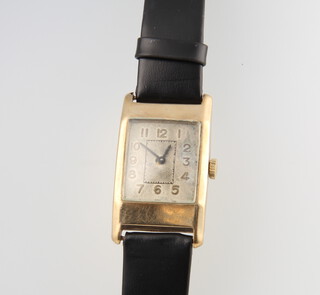 A gentleman's 9ct yellow gold Art Deco Tonneau shaped wristwatch 38mm x 22mm on a leather strap (the movement is replaced and is now quartz) 