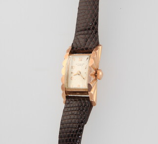 A lady's Art Deco 14ct yellow gold wristwatch inscribed Wittnauer in a sunburst case 28mm x 15mm on a leather strap 