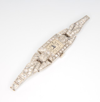 An Art Deco platinum and diamond rectangular cocktail watch and bracelet, gross weight of 19.8 grams 