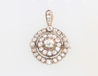 A Victorian yellow metal circular diamond pendant/brooch set 35 diamonds approx. 5.5ct, 30mm, 12.6 grams 