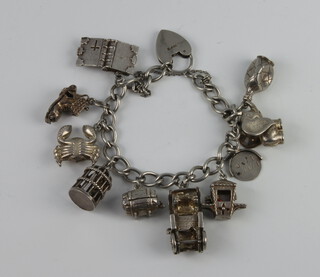 A silver charm bracelet 57 grams 