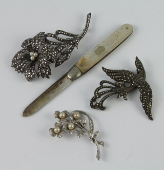 A silver marcasite floral brooch, 2 others and a fruit knife 
