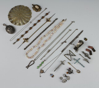 A silver locket and a quantity of vintage and other costume jewellery 