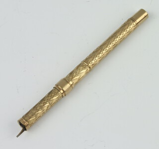An Edwardian engine turned gilt propelling pencil 