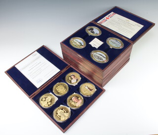 Thirty six gold plated commemorative medallions 