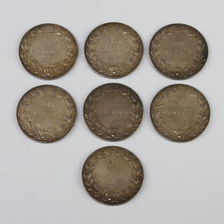 Seven silver tennis medallions 102 grams 