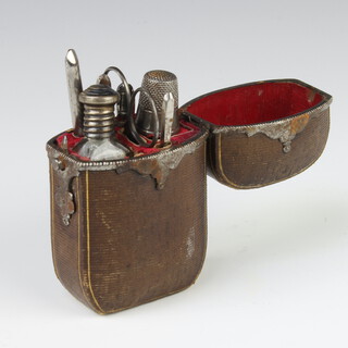 A 19th Century metal mounted leather etui containing 7 steel mounted accessories (ex8) 10cm 