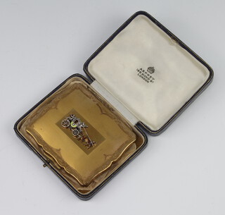 A Stratton vintage gilt marcasite rectangular compact decorated with a coach, contained in an Asprey box 