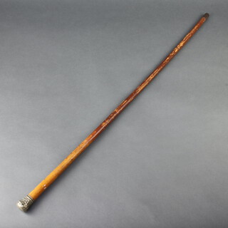 A silver plated mounted walking cane with repousse top 