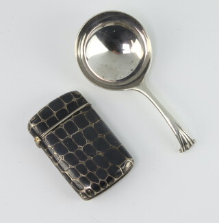 A niello leather effect vesta 4.5cm, a white metal caddy spoon with scroll end 
