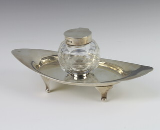 An Edwardian silver modernist inkwell with cut glass well and silver mounts, Birmingham 1902, maker A & J Zimmerman, 18cm 
