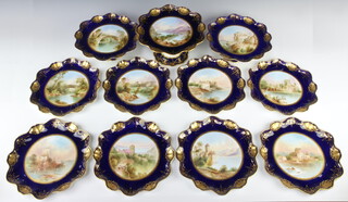 A Victorian dessert service with gilt and dark blue rims enclosing views comprising eight plates "Carrick Fergus Castle", monogrammed FM, the bargle signed  R J Keeling, "Bothwell Castle" signed R J Keeling, "Holy Cross Abbey" signed R J Keeling, "Linlithgoe" signed R J Keeling, "All Saints, Hastings from Eastcliff" signed R J Keeling, "Holy Cross Abbey" monogrammed FM, "Castle of Chilla" signed R J Keeling, two small tazzas "Stirling Castle" signed R J Keeling, "Bridge of Dean"  signed R J Keeling and a larger tazza "Lough Ina" signed R J Keeling, all 22cm diam