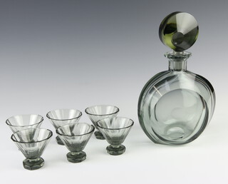 A grey smokey glass liqueur decanter with circular stopper and six tapered tots