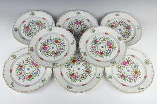 A set of eight Herend plates decorated with basket weave moulding and painted flowers, 25cm diam