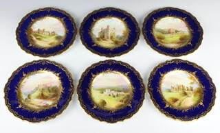 A set of Spode dessert plates with blue and gilt rims enclosing views of Rochester Castle, Dover Castle, Carisbrooke Castle, Ludlow Castle, Kenilworth Castle and Glamis Castle, all signed by J Cross, 23cm diam