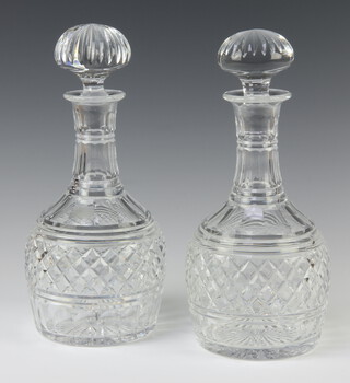 A pair of hobnail cut mallet shaped decanters with mushroom stoppers 24cm 