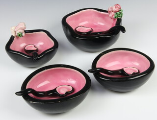 A 1960's ceramic dessert set comprising 4 bowls and 4 ceramic spoons with black exteriors and pink interiors 