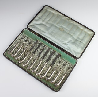 A set of 6 pairs of Edwardian dessert easters with pistol grip handles, Sheffield 1906, cased 