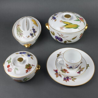 A Royal Worcester Evesham tea and dinner service comprising 9 tea cups, 8 saucers, sugar bowl, 8 small plates, 6 side plates, 13 dinner plates (1 chipped), 2 pie dishes, fruit bowl, souffle, vegetable dish (no lid), 2 sauce boats and 3 stands, an oval dish, 2 large round vegetable dishes and covers, 4 small round vegetable dishes and covers, 1 medium round vegetable dish and cover, 2 shallow dishes and lids, 4 oval vegetable dishes and lids, 1 spare lid and 3 similar Meakins souffles 