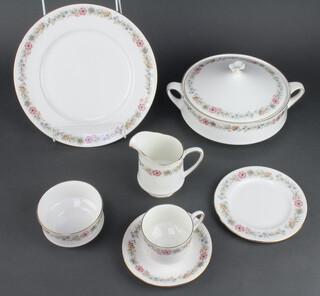 A Royal Albert Belinda pattern part tea and dinner service comprising 6 tea cups, 6 saucers, milk jug, sugar bowl, 6 small plates, 6 side plates, 6 dinner plates, sandwich plate, 6 dessert bowls, 6 soup bowls, 6 large bowls, a tureen and cover, a salad bowl, an oval plate