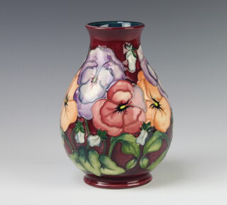 A contemporary Moorcroft baluster vase the red ground decorated anemones 19cm 