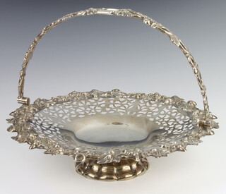 A Victorian cast and pierced silver basket with swing acorn and leaf handle, Sheffield 1849, 508 grams, 26cm 