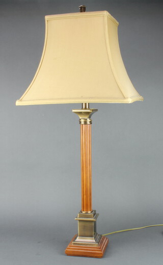 A turned and reeded mahogany and brass mounted table lamp in the form of a column on a stepped base 50cm x 13cm x 13cm 