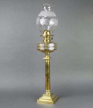 A Victorian circular faceted cut glass oil lamp reservoir raised on a brass Doric column with square stepped base together with an associated etched glass shade 54cm h x 14cm w x 14cm d   