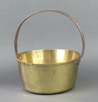 A circular brass preserving pan with polished steel handle, 29cm h x 25cm diam. 