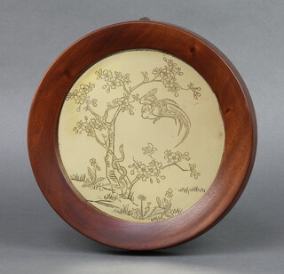 A circular Japanese polished gilt metal plaque depicting tree, serpent and bird 18cm, with seal mark to the reverse, contained in a mahogany frame