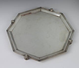 An Art Deco silver octagonal salver raised on triangular feet Sheffield 1938, 874 grams, 33cm 