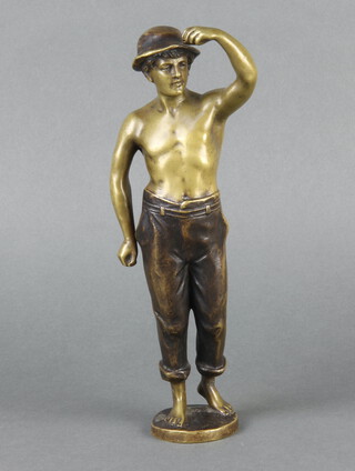 A bronze figure of a standing boy, the base marked Hubert 24cm x 5cm 