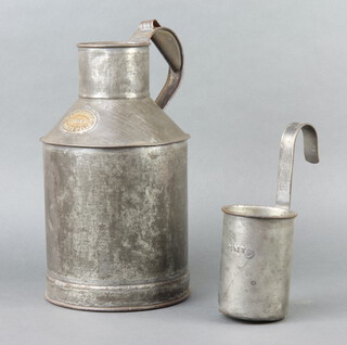 C Loversidge Taman & Co. a metal milk carrier together with a Lester pint ladle 
