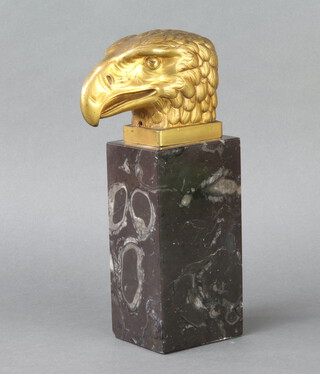 A gilt bronze sculpture of an eagle's head raised on a rectangular black veined marble base 24cm h x 8cm w x 9cm d 