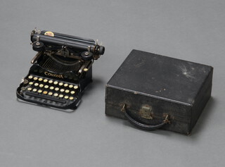 A Corona foldover portable manual typewriter marked patented July 10th 1917, complete with carrying case 12cm h x 28cm w x 25cm d 